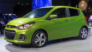 A green Chevy Spark is a new inexpensive car