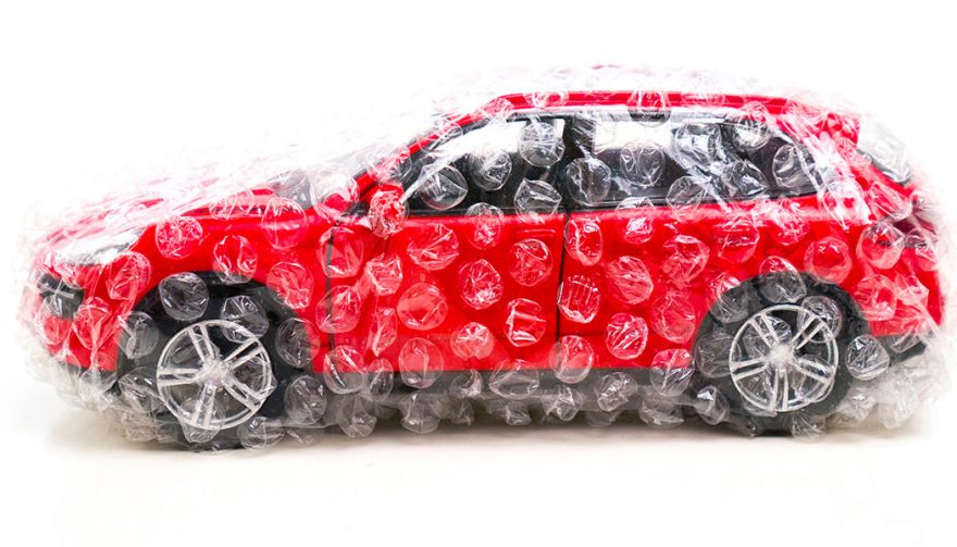 A car wrapped in plastic, as if buying your first new car