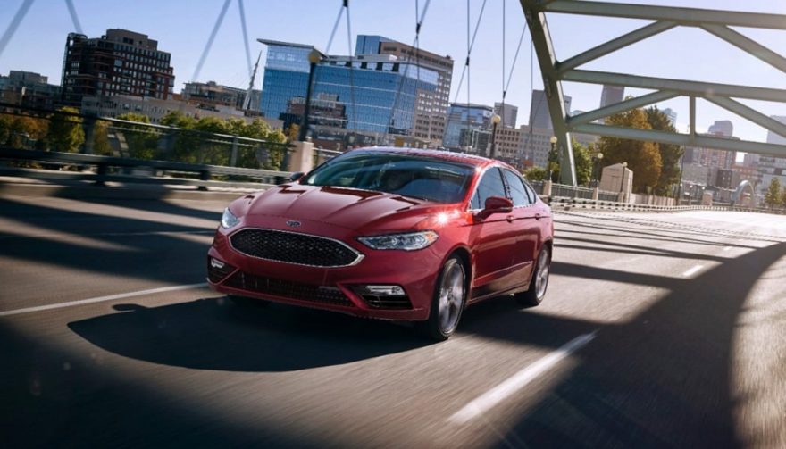 The 2017 Ford Fusion drives across a bridge